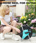 Woman with Garden Hose Reel Cart Holds Fifty To One Hundred Thirty Feet Of Five Eighth Inch Hose Wall Mounted Portable Hose Reel Holder