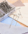 Heavy Duty Stainless Steel T Pins For Blocking And Knitting in a clear storage case with assorted fabric swatches.