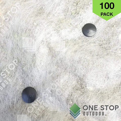 Heavy Duty 4 Inch Landscape Spikes For Weed Fabric Tarps And Erosion Control Durable Plastic Stakes Pack Of 100 For Garden Beds Plant Support And Quick Secure Installation in use on fabric.