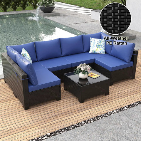 7 Piece Outdoor Patio Sectional Wicker Rattan Set In Coffee Blue With Waterproof Cushions by poolside on wooden deck