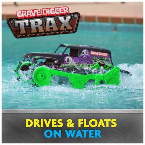 Grave Digger Trax All Terrain Remote Control Vehicle driving on water with tank treads, showcasing its water-friendly design.