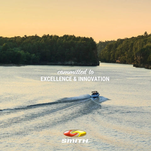 A boat moving on a river at sunset with text 'committed to excellence & innovation' and 'Smith' logo visible.