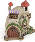 Snail Shell Fairy Cottage Solar Powered LED Light for Outdoor Decor, with red roofs and decorative plants.