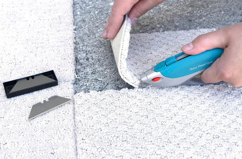 Ten Pack Utility Knife Blades Refills For Box Cutters, Heavy Duty SK5 High Carbon Steel Razor Blades being used to cut carpet
