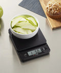Glass Top Food Scale With Touch Controls 11 lb capacity weighing apple slices in kitchen setting