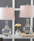 25 Inch Clear Chrome And Brass Glass Table Lamps Set Of 2 With White Linen Drum Shades, Modern Bedside Lamps Displayed in Living Room