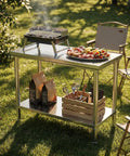 Premium 40x20 Stainless Steel Work Table Beefy Frame Heavy Duty Prep Station With Lower Shelf 600 Pound Capacity outdoors with grill.