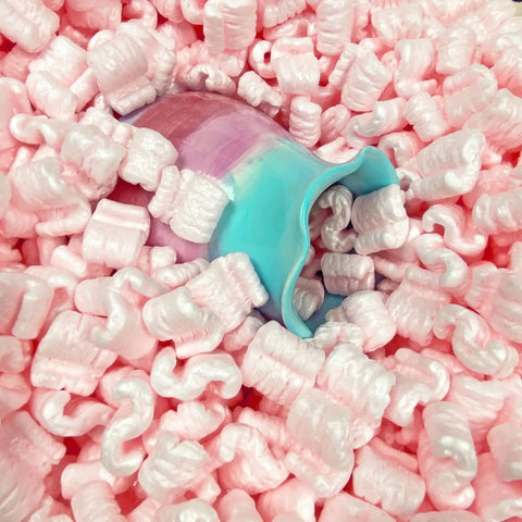 Pink Packing Peanuts For Shipping And Moving, 14 Cubic Feet Antistatic Void Fill Cushioning Supplies in a pile with a colorful vase.