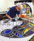 Artist working on stained glass project using Stained Glass Craft Kit For Adults With Full Glass Art Tools Set