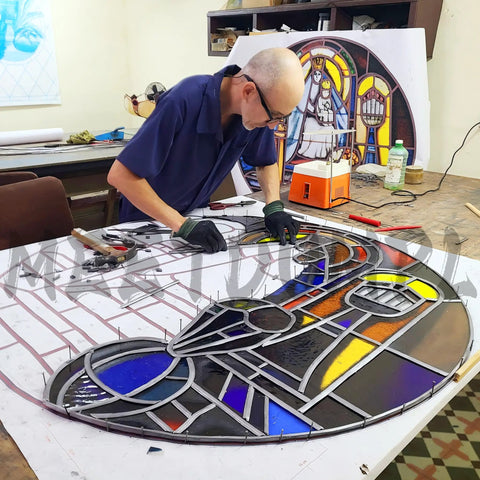Artist working on stained glass project using Stained Glass Craft Kit For Adults With Full Glass Art Tools Set