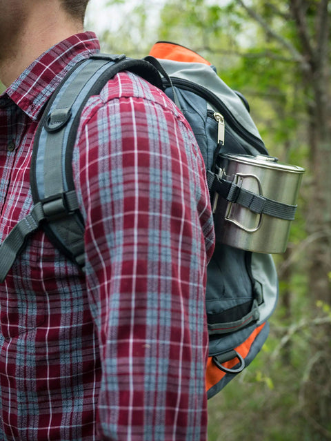 900 Series Backpacking Pot Lightweight Stainless Steel Camping Pot attached to backpack in outdoor setting