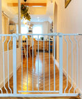 Extra Wide Baby Gate For Openings From 29.1 To 62.2 Inches Warm White Finish Pressure Mounted No Screws Needed Easy One Hand Operation Safe Gate For Kids And Pets In Doorways And Hallways in white installed in hallway