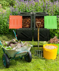 Dual Chamber Tumbling Composter With Sliding Door Heavy Duty Plastic Compost Bin For Backyard Waste Turn Trash Into Treasure With Two Eighteen And A Half Gallon Bins, shown in a backyard with open doors and garden tools.