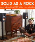 Living room setup with Premium Universal Floor Speaker Stands With Vibration Absorbing MDF Construction and bookshelf speakers
