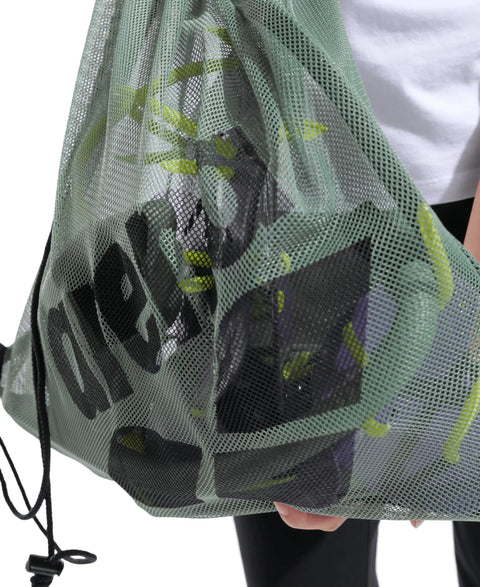Mesh Pool Gear Sack For Swim Team Practice Quick Dry Tote Bag With Drawstring Closure Durable Polyester Swim Equipment Bag For Wet Gear Large 40 Liters Capacity Sage Green. Person holding bag filled with gear.