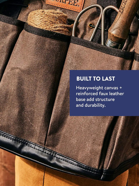 Close-up of brown Waxed Canvas Garden Tool Tote With Eight Exterior Pockets, showing tools and text emphasizing durability.