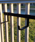 Installed universal adjustable 20 inch planter box bracket kit with 2 heavy duty bottom brackets on vertical spindled deck railing