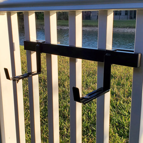 Installed universal adjustable 20 inch planter box bracket kit with 2 heavy duty bottom brackets on vertical spindled deck railing