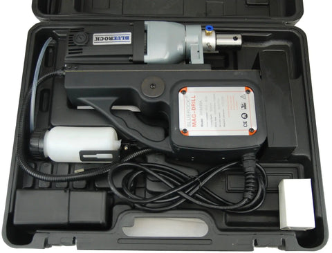 Badass Magnetic Drill With Integrated Knock Out Mode For Serious Construction Grinds in protective case with accessories visible.