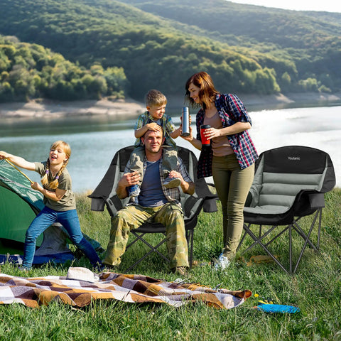 Family enjoying outdoors seated on Beefy Heavy Duty Oversized Camping Chair With Side Pocket And Cup Holder Portable Folding Outdoor Chair For Adults Up To 400 Lbs Perfect For Fishing Sports Camping And Weekend Trips by a lake, with tent and picnic setup nearby.