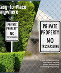 Premium Private Property No Trespassing Sign 12 X 18 Inches Reflective Aluminum Yard Board mounted on a post in greenery.