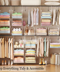 3 Tier Foldable Closet Organizer With Wall Mount And Cabinet Storage Bins displayed with shirts, sweaters, shoes, and accessories.