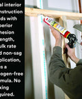 Person applying Fire Block FB 136 Gray single-component cartridge 10.1 fl oz sealant on interior pipe for smoke passage resistance.
