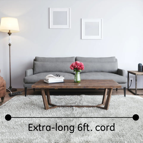 Grey sofa and coffee table in living room, highlighting 6-foot cord feature of 10 Outlet Surge Protector With 2 USB Ports, 3000 Joules.