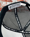 Interior view of Western Style Adjustable Snapback Hat With Patch Logo In Black, featuring mesh and 'In God We Trust' band.