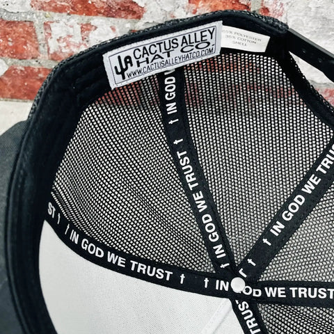 Interior view of Western Style Adjustable Snapback Hat With Patch Logo In Black, featuring mesh and 'In God We Trust' band.