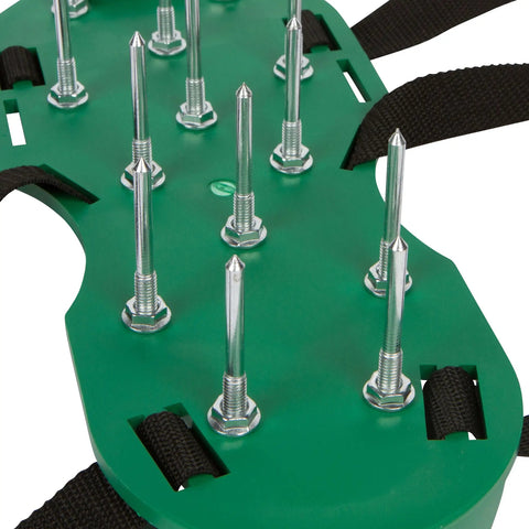 Close-up of green Three Buckle Lawn Aerator Shoes with 13 two-inch metal spikes, showing durable construction and adjustable straps.