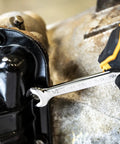 9/16 Inch Swing Arch 4 Degree Ratcheting Combination Wrench with 12 Point Box End in use on machinery