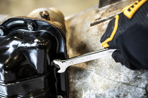 9/16 Inch Swing Arch 4 Degree Ratcheting Combination Wrench with 12 Point Box End in use on machinery