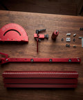 Precision Adjustable Miter Gauge For Table Saw With Solid Aluminum Fence And Smooth Ball Bearing Slide For Dead Straight Crosscuts Bullseye Miters And Router Tables, red aluminum parts arranged on wooden surface.