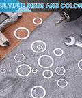 Built Tough Aluminum Flat Washers 100 Piece Pack 18X24X1.5mm Silver in various sizes and shapes on a work surface.