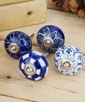 Top Shelf 10 Pack Ceramic Cabinet Knobs With Blue And White Printed Antique Patterns Sweet Glossy Finish Drawer Pull Handles For Kitchen Cupboards And Wardrobes Legit Home Decor displayed on wooden surface.