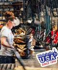 Factory worker assembling cookware with 'Made in the USA Since 1896' badge prominently displayed in the foreground.