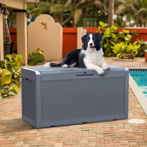 Dog sitting on Huge 100 Gallon Outdoor Resin Deck Box With Lockable Lid For Patio Furniture Cushions Garden Tools And Pool Supplies Waterproof Weatherproof Storage With Large Capacity Dark Grey next to pool