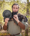 Person holding Beefy Hand Forged 12 Gauge Iron Shield Boss Umbo For Reenactment And DIY Shields, 20 Cm Domed Hammered Surface, outdoors