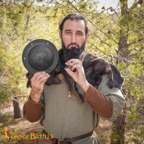 Person holding Beefy Hand Forged 12 Gauge Iron Shield Boss Umbo For Reenactment And DIY Shields, 20 Cm Domed Hammered Surface, outdoors