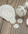 PATIKIL 51mm foam lid liner discs and pressure-sensitive tamper seal, 50-pack, shown beside a clear bottle.