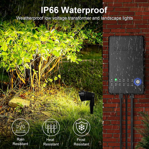 All In One Outdoor Landscape Lighting Kit With Eight 5W LED Spotlights, waterproof transformer by a lit bush at night