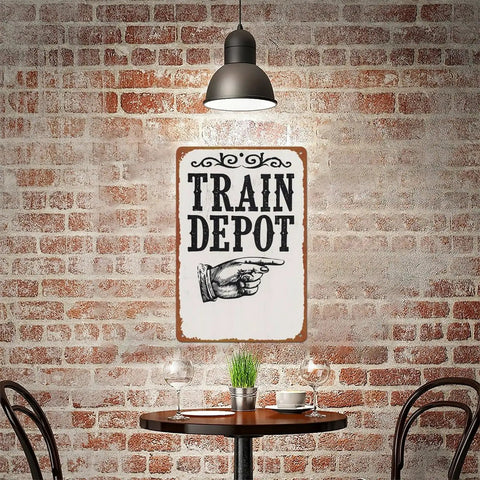 Train Depot Aluminum Wall Decor 12x8 Inch sign in cafe setting with exposed brick wall and metal furniture.