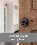 Entry Door Lever Handle With Keyed Lock And SmartKey Re-key Technology in Venetian Bronze on a wooden door
