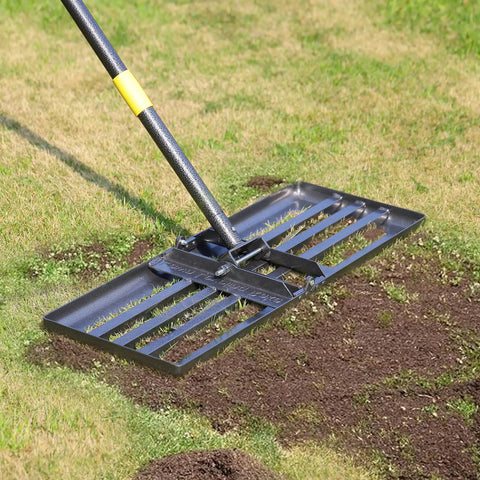 Heavy Duty Lawn Leveling Rake with stainless steel handle on grass, showing soil smoothing in progress. 72 inch yard tool for lawns.