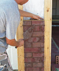 Heavy Duty Mason Line For Pros Bonded Nylon Braided 500 Foot String Line In Yellow And Black Size 18 in use on brick wall