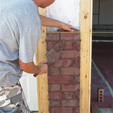 Heavy Duty Mason Line For Pros Bonded Nylon Braided 500 Foot String Line In Yellow And Black Size 18 in use on brick wall