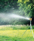 Heavy Duty Rock Solid Half Inch Zinc Impact Sprinkler 2 Pack adjustable head on tripod watering grass in large yard.