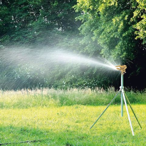 Heavy Duty Rock Solid Half Inch Zinc Impact Sprinkler 2 Pack adjustable head on tripod watering grass in large yard.
