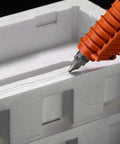 Glue gun applying Clear Hot Melt Adhesive 3792 PG, 1 In X 3 In, 22 Pound Case to foam packaging